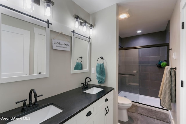 245 Lost Creek Ln, Priest River, ID 83856 - bathroom featuring toilet, double vanity, and a shower stall