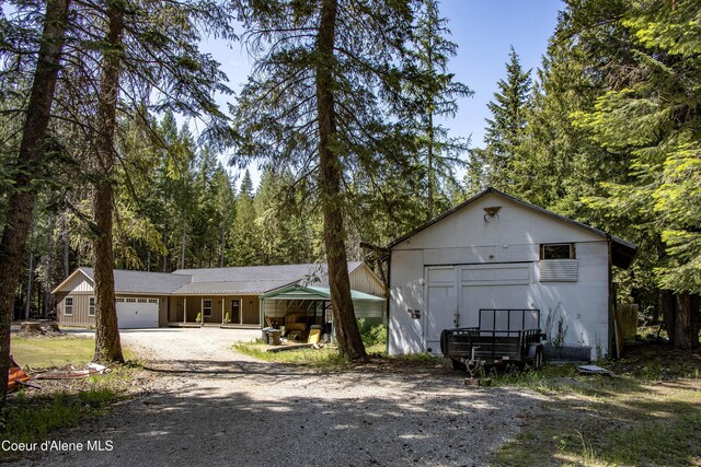 245 Lost Creek Ln, Priest River, ID 83856 - view of front of home with driveway and an attached garage