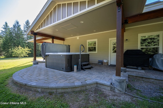 13 Park Dr, Spirit Lake, ID 83869 - view of patio / terrace featuring a hot tub and area for grilling