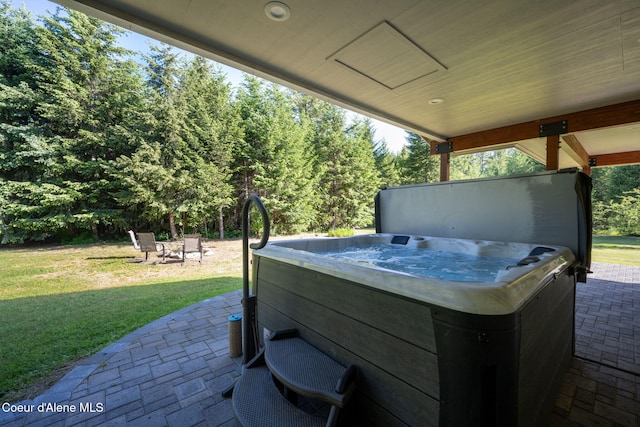 13 Park Dr, Spirit Lake, ID 83869 - view of patio / terrace with a hot tub