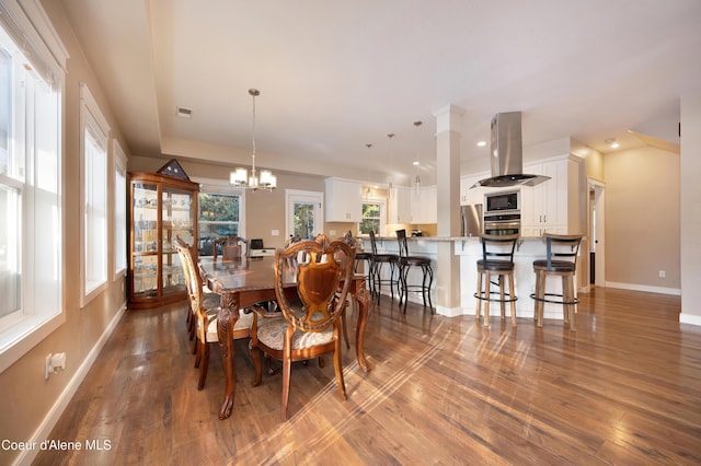 13 Park Dr, Spirit Lake, ID 83869 - dining space featuring dark wood-type flooring, a chandelier, baseboards, and recessed lighting