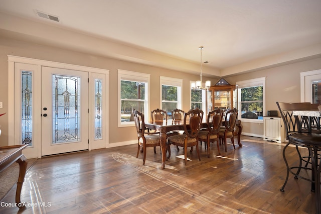 13 Park Dr, Spirit Lake, ID 83869 - dining room with a chandelier, dark wood-style flooring, and baseboards