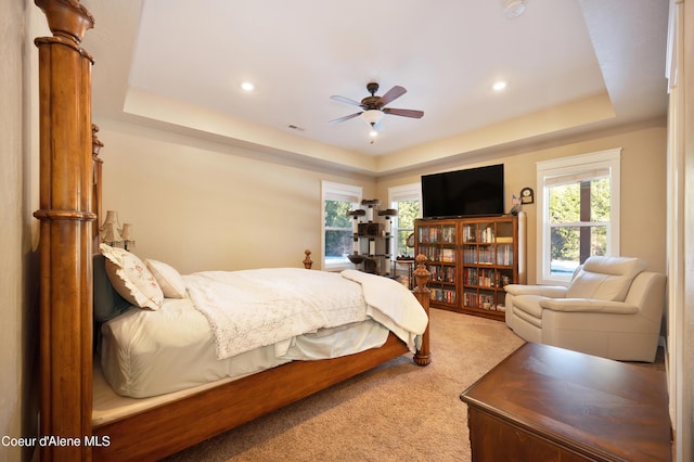 13 Park Dr, Spirit Lake, ID 83869 - bedroom with a raised ceiling, carpet, multiple windows, recessed lighting, and ceiling fan