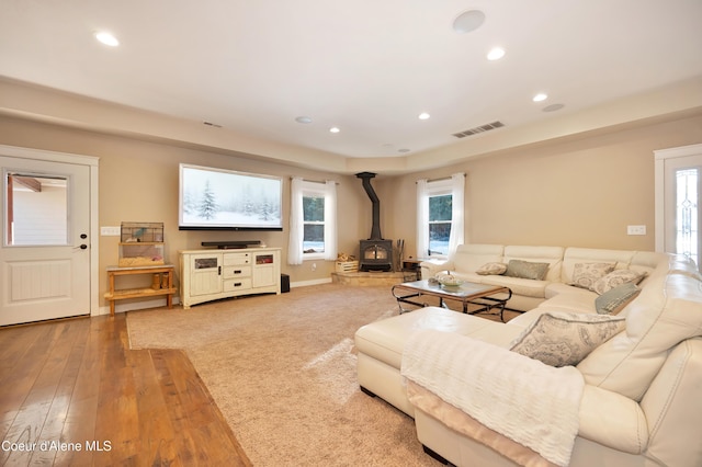 13 Park Dr, Spirit Lake, ID 83869 - living area featuring a wood stove, recessed lighting, and hardwood / wood-style floors