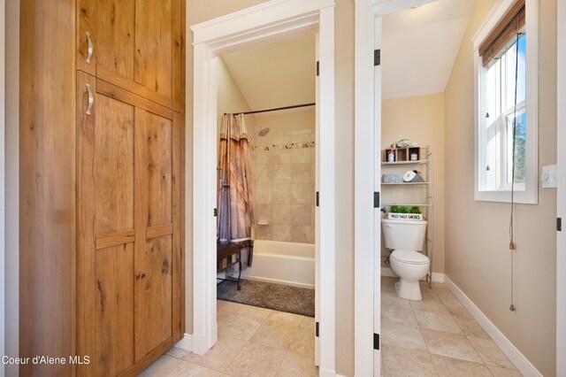13 Park Dr, Spirit Lake, ID 83869 - full bathroom with toilet, shower / bath combo with shower curtain, baseboards, and tile patterned flooring