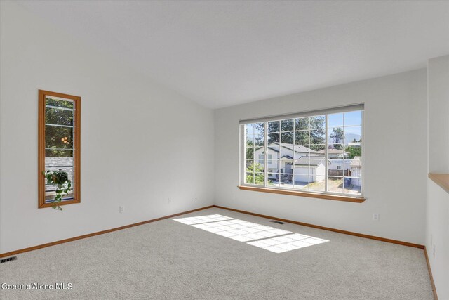 3203 N 12th St, Coeur Dalene, ID 83815 - empty room featuring carpet flooring and vaulted ceiling