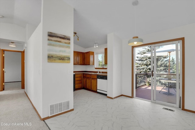3203 N 12th St, Coeur Dalene, ID 83815 - kitchen featuring dishwasher, brown cabinetry, vaulted ceiling, light marble finish floors, and decorative light fixtures