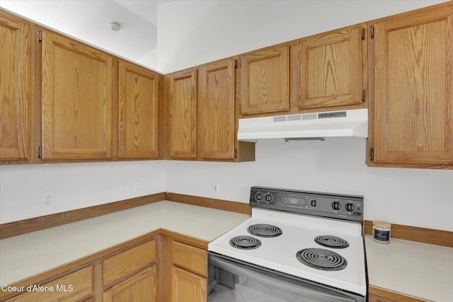 3203 N 12th St, Coeur Dalene, ID 83815 - kitchen with white electric range oven, under cabinet range hood, and light countertops