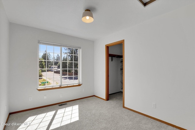 3203 N 12th St, Coeur Dalene, ID 83815 - unfurnished bedroom featuring a spacious closet, carpet flooring, and a closet