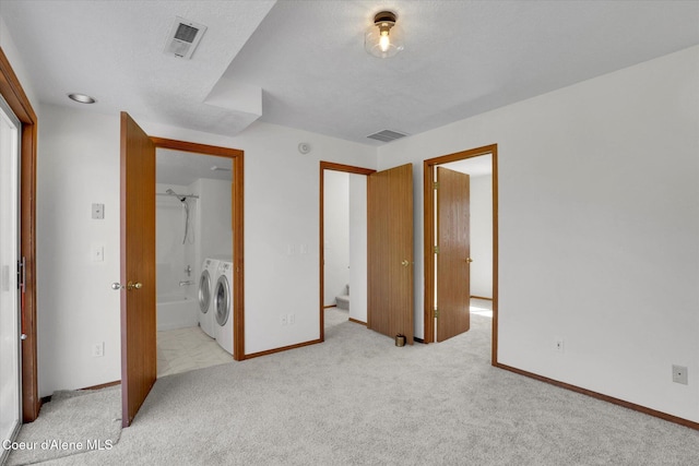3203 N 12th St, Coeur Dalene, ID 83815 - unfurnished bedroom featuring washing machine and dryer, light colored carpet, and ensuite bath
