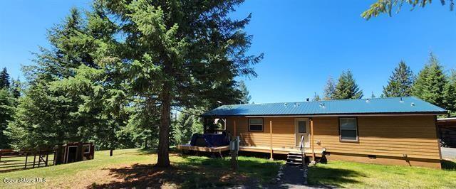 229 Henderson Lp, Kamiah, ID 83536 - rear view of property with a lawn
