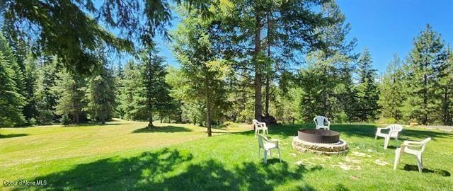 229 Henderson Lp, Kamiah, ID 83536 - view of grassy yard with a fire pit