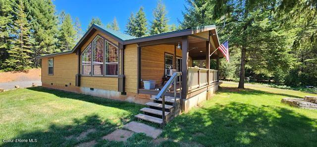 229 Henderson Lp, Kamiah, ID 83536 - view of side of property with crawl space, a lawn, and covered porch