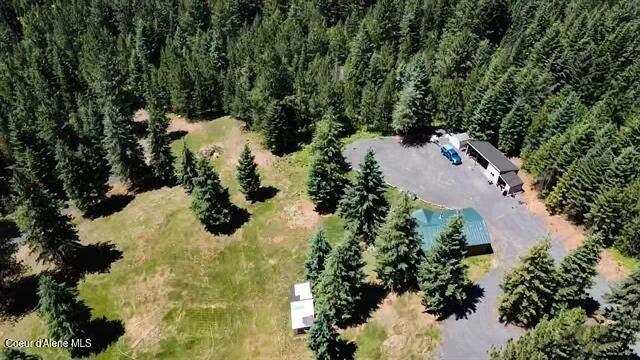 229 Henderson Lp, Kamiah, ID 83536 - aerial view of property and surrounding area featuring a heavily wooded area