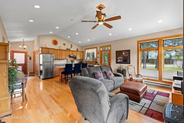9307 Lakeshore Dr, Sagle, ID 83860 - living area with a chandelier, light wood-type flooring, a ceiling fan, recessed lighting, and a baseboard heating unit