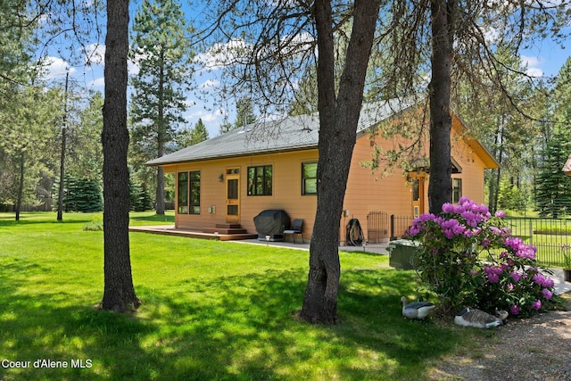 9307 Lakeshore Dr, Sagle, ID 83860 - back of house with a patio