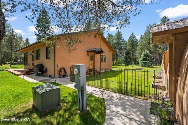 9307 Lakeshore Dr, Sagle, ID 83860 - view of property exterior featuring a fenced front yard and entry steps