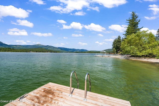 9307 Lakeshore Dr, Sagle, ID 83860 - dock featuring a water and mountain view
