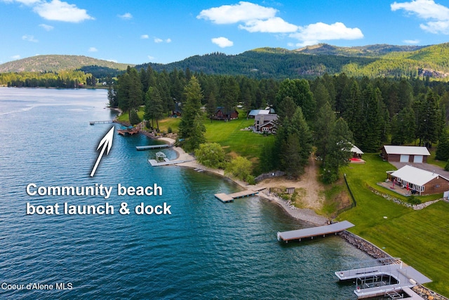 9307 Lakeshore Dr, Sagle, ID 83860 - bird's eye view of a water and mountain view and a heavily wooded area