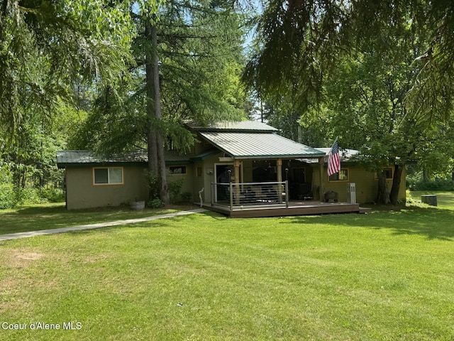197 Berry Hl, Cocolalla, ID 83813 - back of property with a lawn and a metal roof