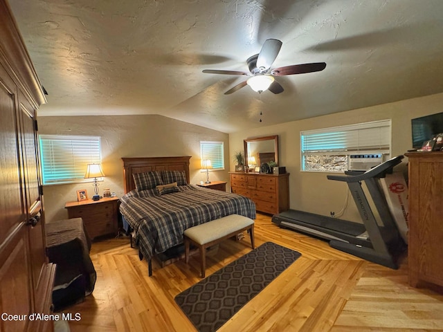 197 Berry Hl, Cocolalla, ID 83813 - bedroom featuring light wood-style flooring, vaulted ceiling, ceiling fan, and cooling unit