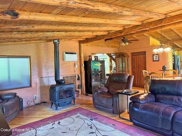 197 Berry Hl, Cocolalla, ID 83813 - living room featuring a wooden ceiling with exposed beams, wood finished floors, a wood stove, a chandelier, and a ceiling fan