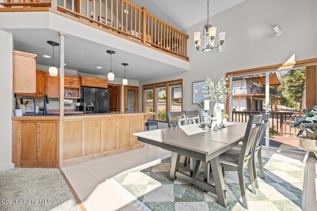 106 Stewart Dr, Blanchard, ID 83804 - dining area featuring a chandelier, high vaulted ceiling, light tile patterned flooring, and recessed lighting