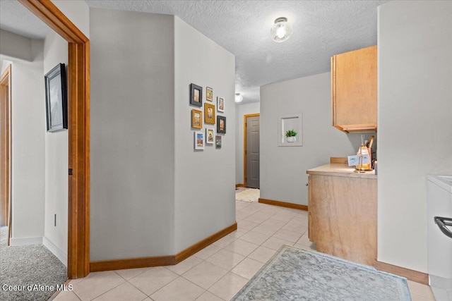 106 Stewart Dr, Blanchard, ID 83804 - hall with a textured ceiling, light tile patterned floors, and baseboards