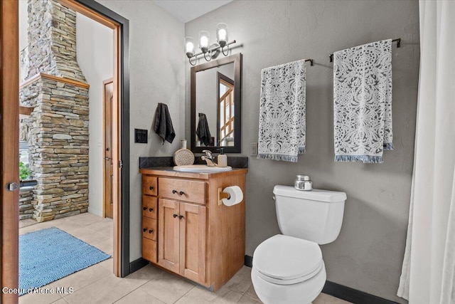 106 Stewart Dr, Blanchard, ID 83804 - bathroom with vanity, toilet, tile patterned floors, and baseboards
