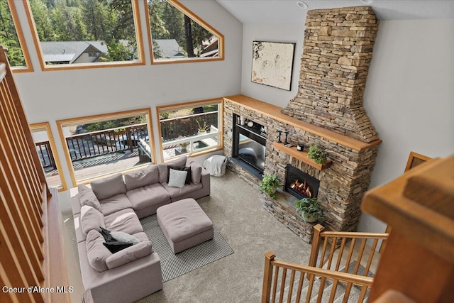 106 Stewart Dr, Blanchard, ID 83804 - living room featuring healthy amount of natural light, carpet flooring, and a stone fireplace
