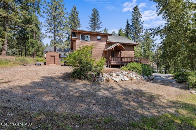 106 Stewart Dr, Blanchard, ID 83804 - view of front facade with a wooden deck