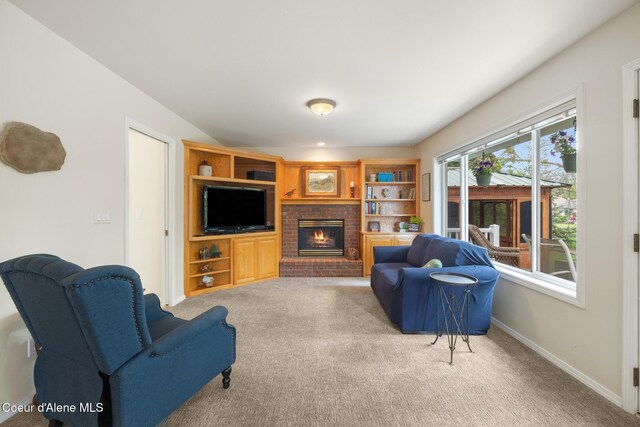 4950 E Frazier Dr, Post Falls, ID 83854 - living area with a fireplace, carpet floors, and baseboards