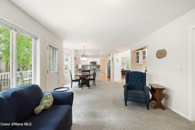 4950 E Frazier Dr, Post Falls, ID 83854 - living area with light colored carpet and baseboards