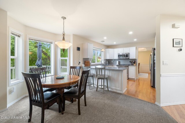 4950 E Frazier Dr, Post Falls, ID 83854 - dining area featuring baseboards, light wood-style flooring, and recessed lighting
