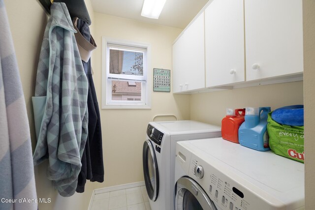 4950 E Frazier Dr, Post Falls, ID 83854 - laundry area featuring separate washer and dryer, cabinet space, and baseboards