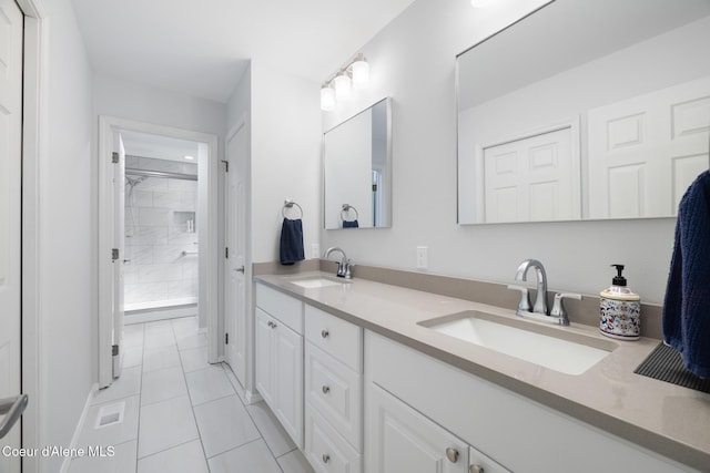 4950 E Frazier Dr, Post Falls, ID 83854 - bathroom featuring double vanity, tile patterned floors, and tiled shower