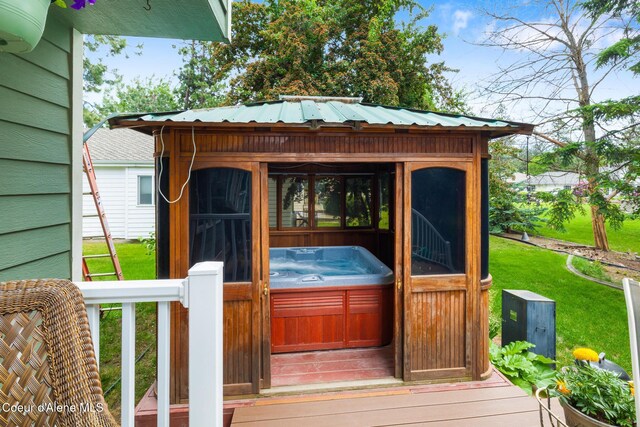 4950 E Frazier Dr, Post Falls, ID 83854 - wooden terrace featuring a hot tub and a lawn