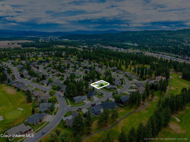 4950 E Frazier Dr, Post Falls, ID 83854 - view of property location featuring property boundaries highlighted, a mountain backdrop, nearby suburban area, and a local golf course