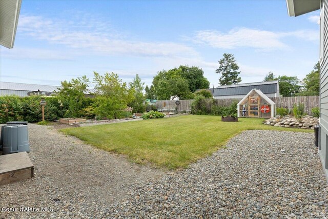 9670 N Meadow Way, Hayden, ID 83835 - view of yard featuring an exterior structure and an outbuilding