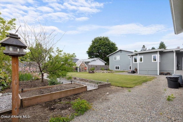 9670 N Meadow Way, Hayden, ID 83835 - view of yard featuring a garden