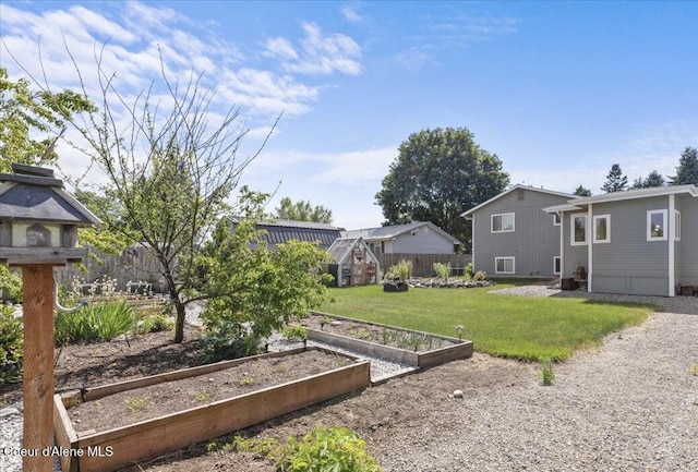9670 N Meadow Way, Hayden, ID 83835 - view of yard featuring a vegetable garden