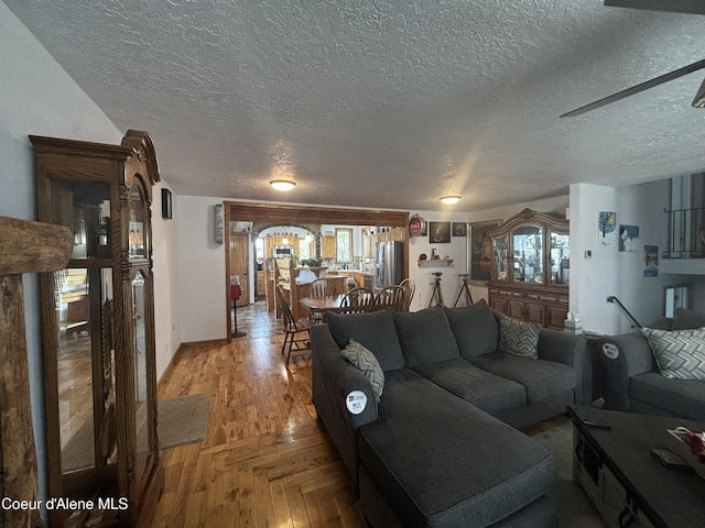 9670 N Meadow Way, Hayden, ID 83835 - living area with a textured ceiling, healthy amount of natural light, and light wood-style flooring