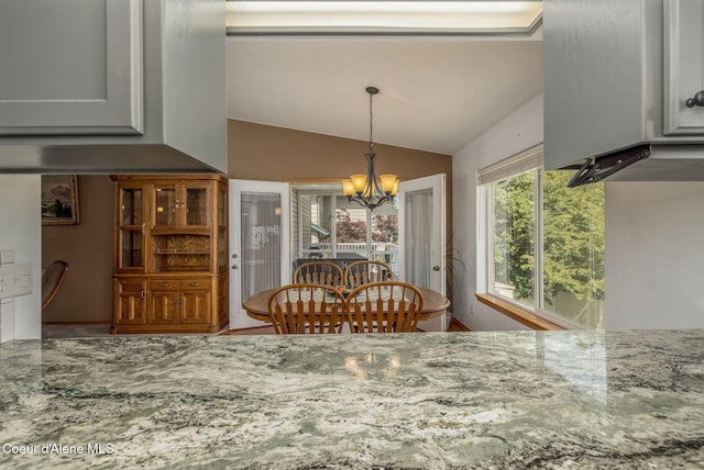 8846 N Clarkview Pl, Hayden, ID 83835 - dining room with a chandelier and lofted ceiling