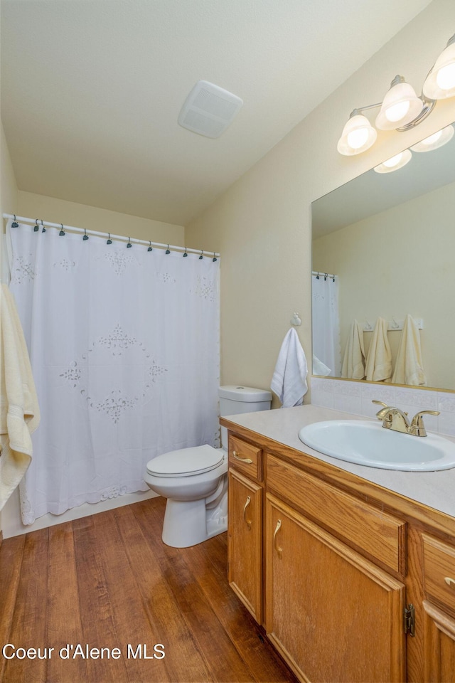 8846 N Clarkview Pl, Hayden, ID 83835 - bathroom featuring vanity and wood finished floors