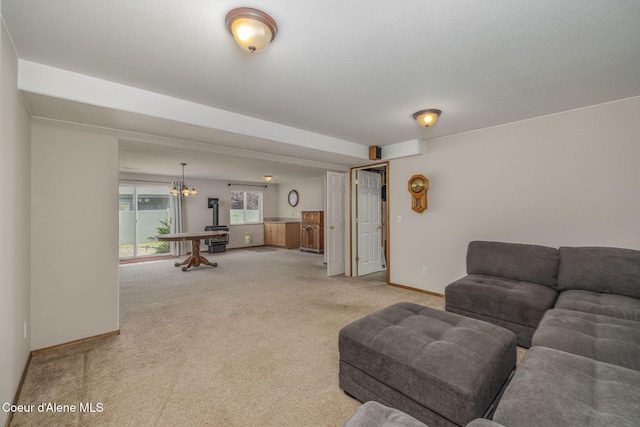 8846 N Clarkview Pl, Hayden, ID 83835 - living room with light carpet and a chandelier