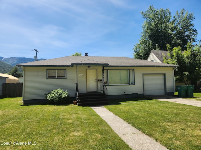 607 W Riverside Ave, Kellogg, ID 83837 - view of front of home featuring an attached garage, driveway, and roof with shingles