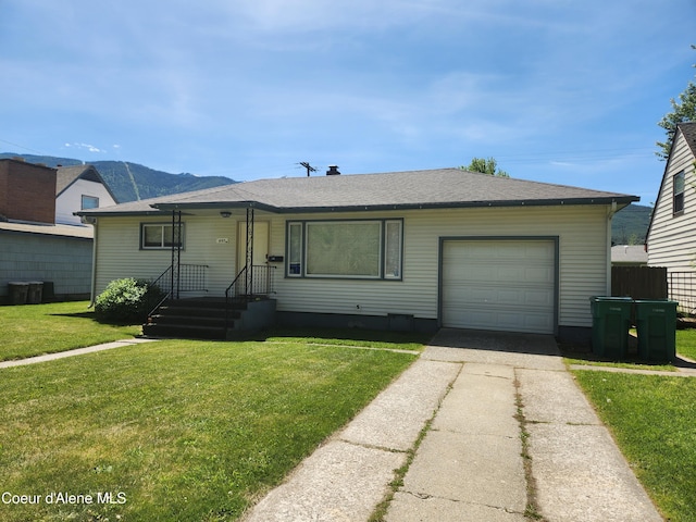 607 W Riverside Ave, Kellogg, ID 83837 - view of front of home with concrete driveway, a front lawn, an attached garage, and roof with shingles
