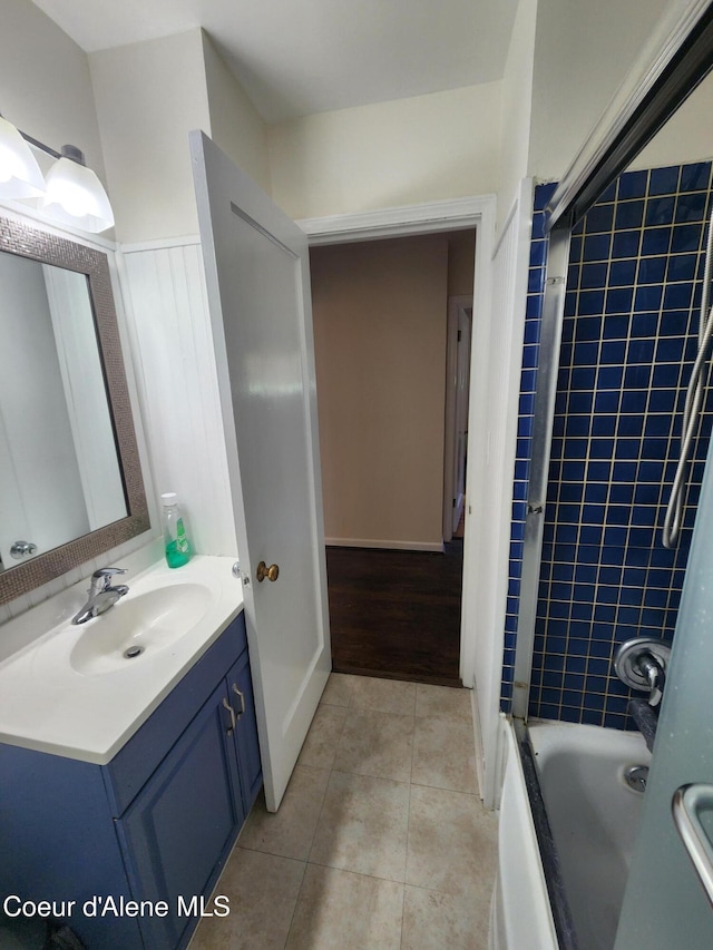 607 W Riverside Ave, Kellogg, ID 83837 - bathroom featuring vanity, tile patterned flooring, and shower / washtub combination