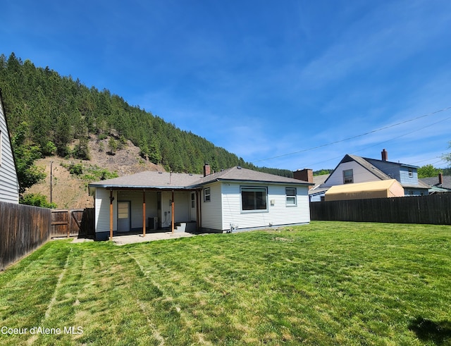 607 W Riverside Ave, Kellogg, ID 83837 - rear view of house featuring a patio