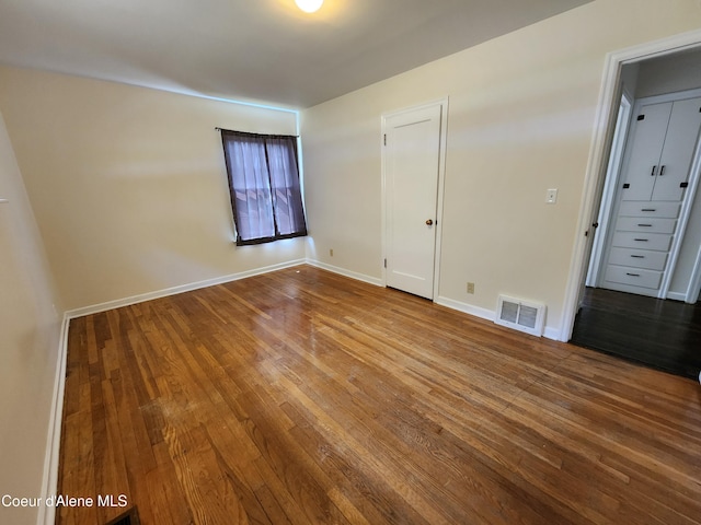 607 W Riverside Ave, Kellogg, ID 83837 - spare room with wood finished floors and baseboards